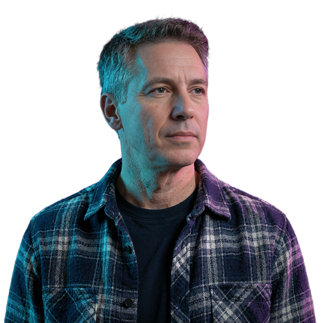 Man in a navy plaid flannel shirt, aged 46, cautious reviewer portrait used in this independent MatureSearch review